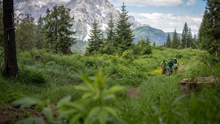Into the Gsiesertal © Markus Greber Three mountain bikers riding through green alpine landscape with mountains