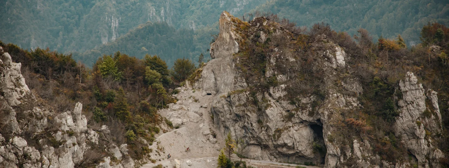 Tremalzo © David Karg Cyclists on a mountain forest path with rocks and caves