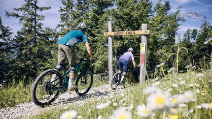 Augst Trail © Tobias Köhler Two people mountain biking on a forest trail called Augst Trail