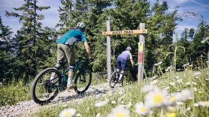Augst Trail © Tobias Köhler Two people mountain biking on a forest trail called Augst Trail