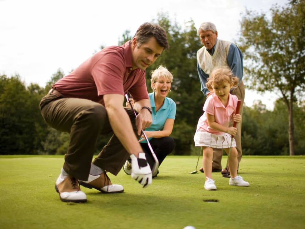 "Golf & Lake" UNLIMITED days Family playing golf on the green with a young girl and grandparents
